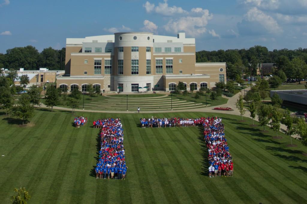 The Class of 2017 stand in the middle of the Quad forming '17. 