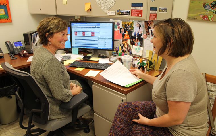 Freshman nursing major Megan Peninger discusses her upcoming fall schedule with Academic Adviser Connie Walker in the College og Nursing and Health Professions Advising center Monday. Photo by Hannah Spurgeon/The Shield