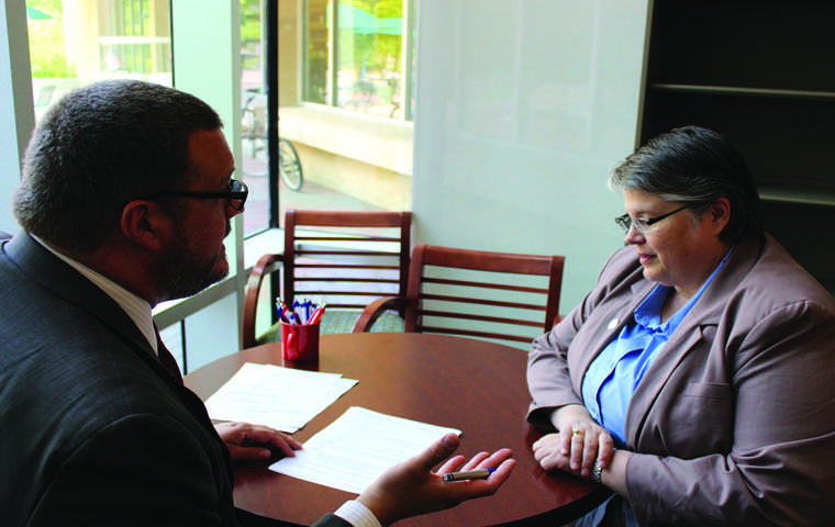 New Assistant Dean of Student Laurie Berry goes over paperwork with Dean of Students Bryan Rush Tuesday at DOSO/The Shield Isaac Williams