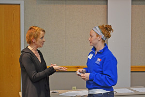 Amie McKibban talks to a resident assistant during Safe Zone training Saturday.  Armon Siadat/The Shield