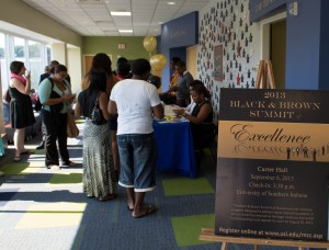 Students receive name tags and registration info for summit. By Nigel Meyer/The Shield