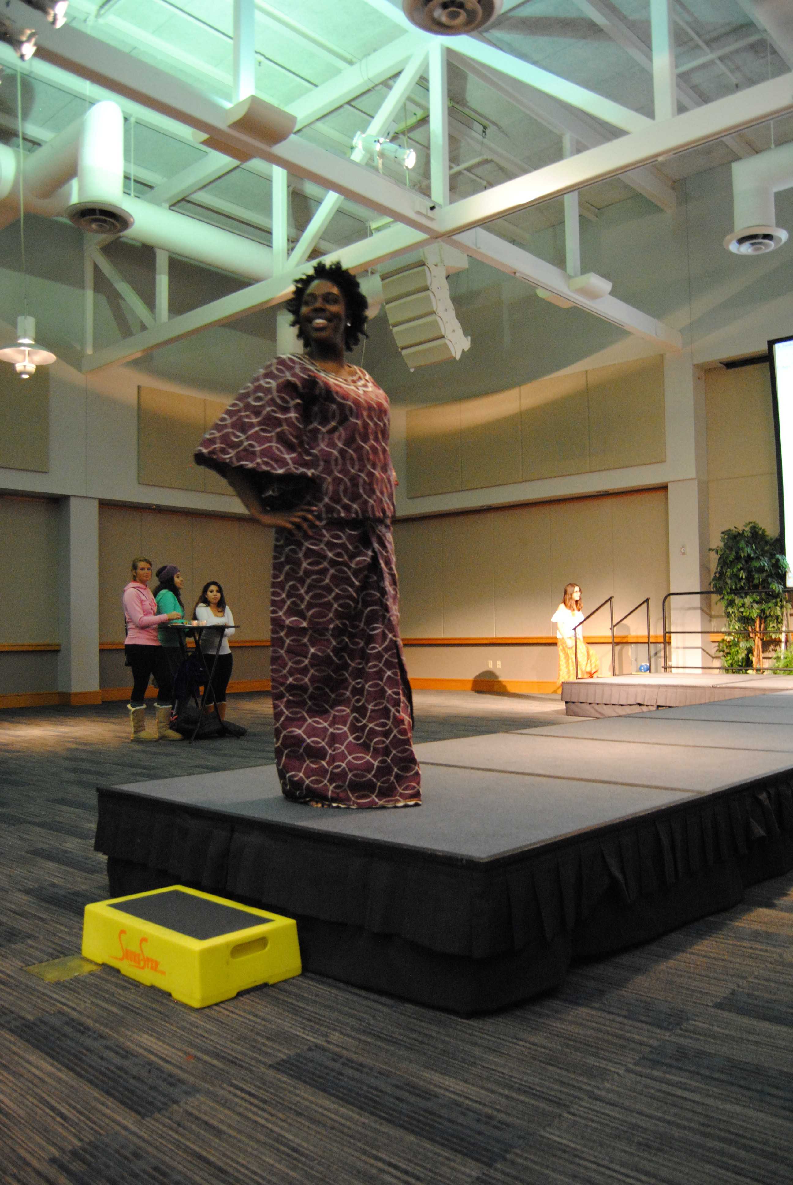 Senior psychology major Ariel Crenshaw poses in her hand-made dress from Ghana. Photo by Alyssa Smith/The Shield