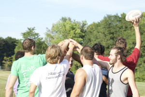 Members of the rugby team huddle before a practice in September. The team won a state title Saturday at the Indiana Rugby Football Union tournament in Indianapolis.