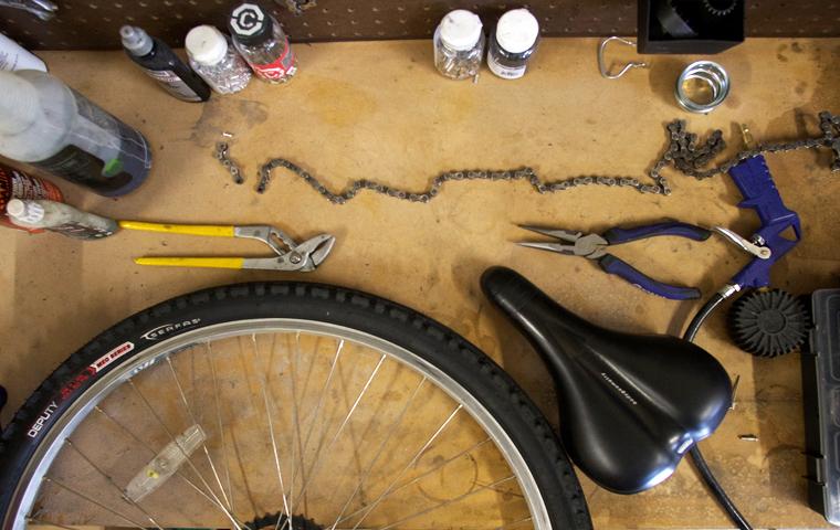 Tools that will be used in the upcoming bike repair program are displayed across a workbench in the Recreation Fitness and Wellness Center.