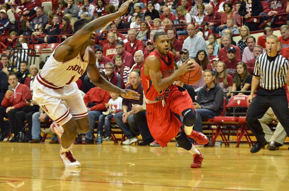 Southern Indiana senior guard Lawrence Thomas drives to the basket in last month's exhibition game at Indiana University in Bloomington. PHOTO by JIMMY PYLES