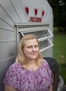 Kristen Wilkins in front of her 1964 trailer, Alice Avion.