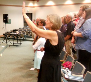 Chi Alpha Group Pastor Bev Freud participates in a vigil honoring Emily Lengacher Thursday night in Mitchell Auditorium. 