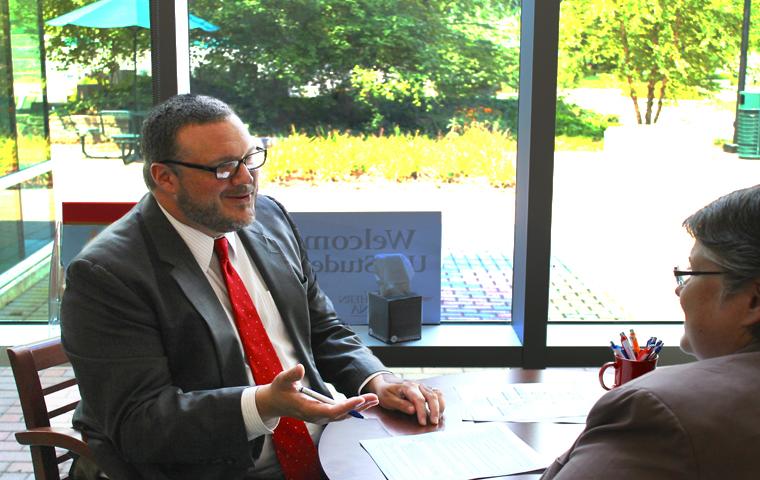 New Dean of Students Bryan Rush talk with Assistant Dean of Students Laurie Berry at DOSO Tuesday. Photography by Isaac Williams/The Shield