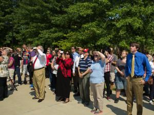 The crowd at the topping-off ceremony watches the last beam be put into place. Photo by NIGEL MEYER/The Shield