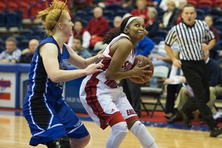 Senior Autumn Miller fights for the ball in the Eagle's game against Rockhurst University over winter break.