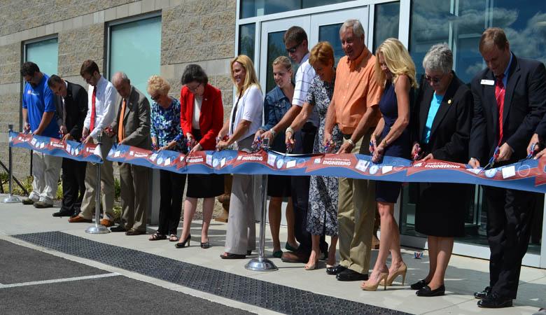 Members of the USI community and Evansville engineering community cut the ribbon for the Applied Engineering Center Friday on USI's campus.