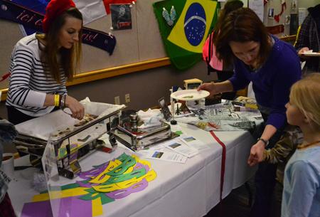 Bianca Benoist, a pre-law student from France, serves Nutella crepes to Food Expo attendees.