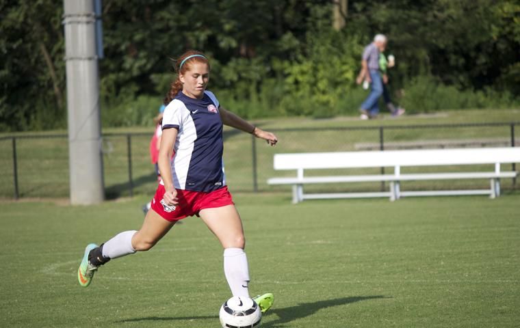 Sophomore defender, Sadie Schumann, advances the ball downfield.