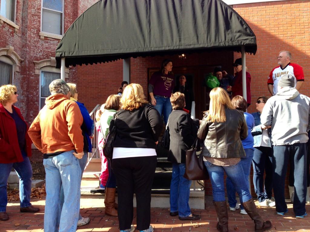 Assistant Professor of Art and Empty Bowls Organizer Alisa Holen welcomes a large crowd as they wait outside Kirby's Fine Dining Saturday morning. 