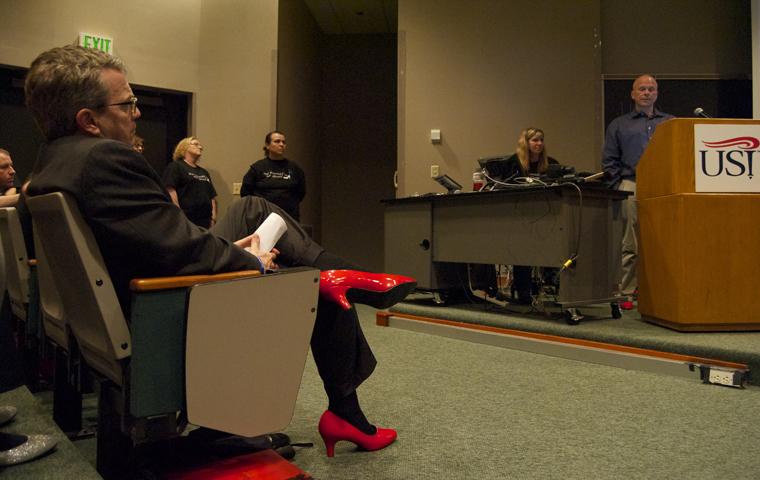 Mayor Lloyd Winnecke Listens to Jerry Lewis speak at To Walk a Mile in Her Shoes Tuesday in Mitchell Auditorium.